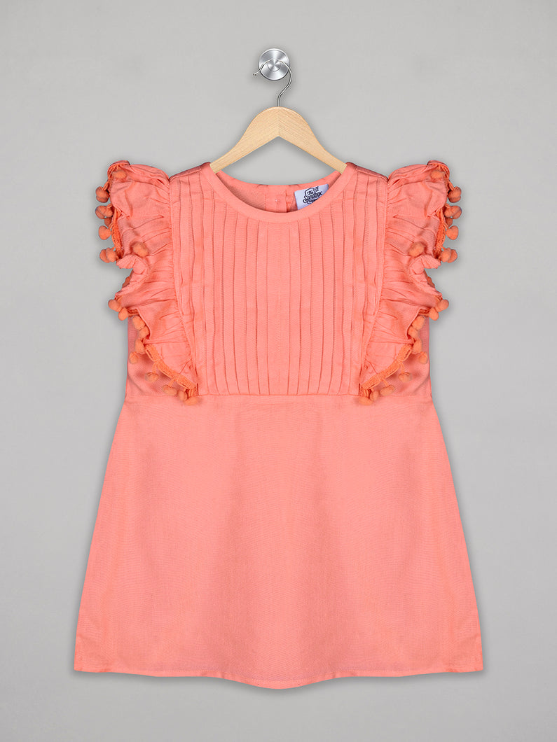 Solid orange knee length dress for girls with pom pom detailing