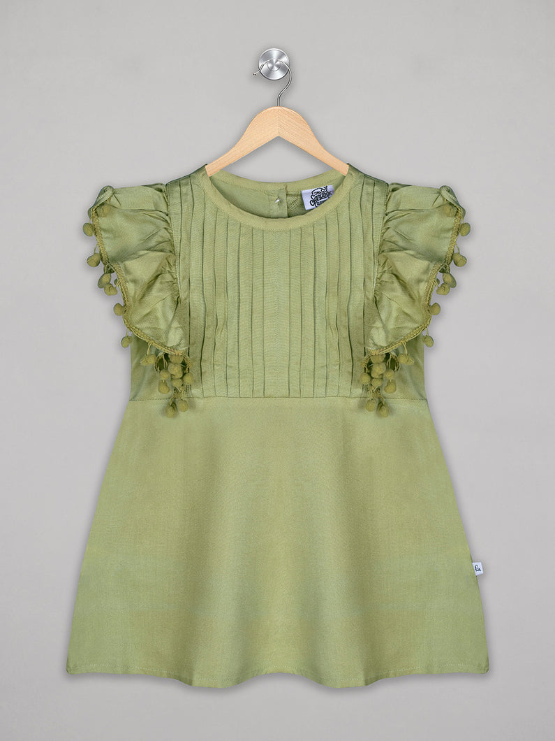 Solid green knee length dress for girls with pom pom detailing
