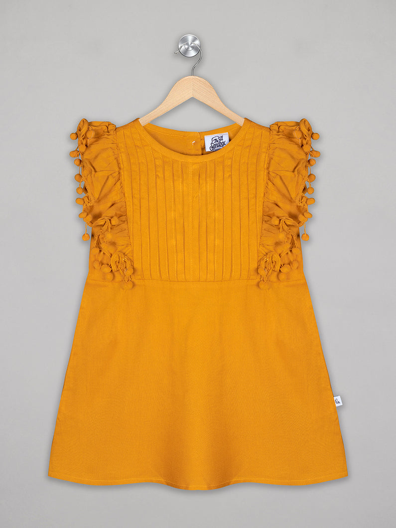 Solid yellow knee length dress for girls with pom pom detailing